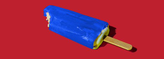 An electric blue ice lolly on a red background